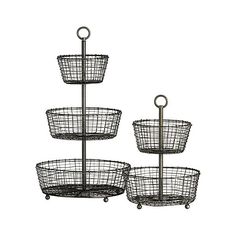 three tiered metal basket holder on wheels with hooks and handles, each holding two baskets