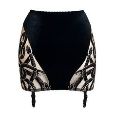 The latest addition to our Viper range, our garter skirt is a timeless classic. Now available as Ready to Own so you won't have to wait to wear your new fave piece! Handmade see-through mesh garter skirt with signature black snakes design on nude sheer mesh (fair skin tone) and central sultry black velvet panelling (both front and rear). Inner lining for added comfort. Four non-detachable garters. PLEASE NOTICE: CUSTOMIZATION OPTIONS ARE NOT AVAILABLE ON RTO ITEMS. We only offer a selected number of styles, designs and sizes in our "Ready to Own" range to guarantee quick processing and shipping. 100% Made in Italy. Garment Care: suitable for washing machine with 30 degrees gentle cycle and delicate detergent. DO NOT TUMBLE DRY!Check our chart to find the best size for you! Items from the R Snakes Design, Garter Skirt, Halter Bra, Fair Skin Tone, Snake Design, Fair Skin, Bra Lingerie, Timeless Classic, Skin Tone