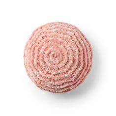 a round pink object on a white surface