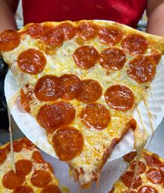 three slices of pepperoni pizza sitting on top of white paper plates with toothpicks