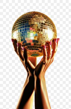 two hands holding up a disco ball in the air, with one hand on it's head