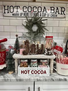 hot cocoa bar displayed on counter with christmas decorations