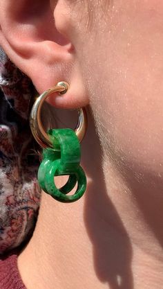 "Phenomenal mid-century 14K gold hoop and hand carved Jade earrings. Astonishingly, singularly carved, Jadeite chains hang from the richest and shiniest 14K gold hoops. The hoops are a unique style of clip on for non-pierced ears. Their dimensions get thicker toward the center where they have a hinge mechanism inside the hoops. The hoops twist open from the hinge and therefore open up at the end that connects to the ear. When pressure is taken off the hinge the earrings close back up, allowing f Green Jade Hoop Jewelry, Unique Green Hoop Jewelry, Yellow Gold Pierced Jade Jewelry, Carved Jade, Cultured Pearl Necklace, Jade Earrings, Jade Carving, Small Rings, Gold Hoops