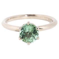 Simple and sweet, The Midori Ring is a jewel for all occasions. Crafted in 18 carat white gold, her green tourmaline is set to allow her to bask in nature's light. A classic style with a minty-green twist. ﻿﻿  The Midori Ring Gem Details The oval light bluish green tourmaline measures 7.00x6.75x4.90 millimetres and is estimated to weigh 1.50 carats. Ring Size M (Australia and UK sizing) or 6 1/4 (US and Canada) The Midori Ring can be resized prior to shipping upon request. Resizing is compliment Contemporary Light, Green Oval, Minty Green, Bluish Green, Contemporary Lighting, Green Tourmaline, Jewelry Rings Engagement, Vintage Jewellery, Solitaire Ring