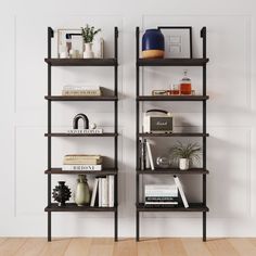 a bookshelf with several different types of books on it in a living room