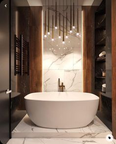 a large white bath tub sitting inside of a bathroom