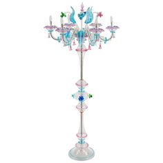 a multi - colored glass candelabra with five lights