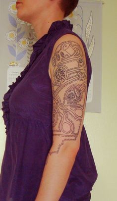 a woman with a tattoo on her arm