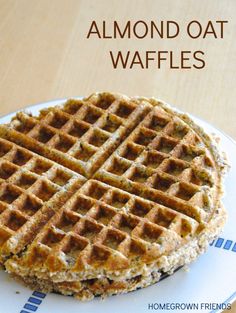 two waffles stacked on top of each other with the words, almond oat waffles