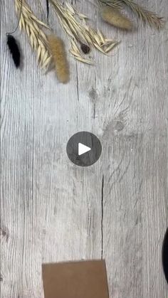 the video is showing how to use scissors and other tools for cutting wheat on a wooden table