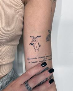 a woman with a tattoo on her arm