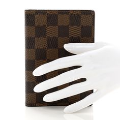 This is an authentic LOUIS VUITTON Damier Ebene Small Ring Agenda Cover. This practical and stylish Louis Vuitton accessory is crafted of Louis Vuitton Damier checkered canvas with a polished gold snap closure. The agenda opens to a mocha brown cross-grained leather interior with card slots, flat pockets and a gold six ring binder. Agenda Cover, Small Ring, Louis Vuitton Accessories, Mocha Brown, Louis Vuitton Damier Ebene, Damier Ebene, Small Rings, Ring Binder, Leather Interior