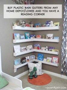 a child's room with bookshelves on the wall and stuffed animals in the corner