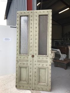 an old pair of double doors in a warehouse