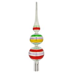 a multicolored glass sculpture on a metal pole with a white base and two red, yellow, green, orange, and pink stripes