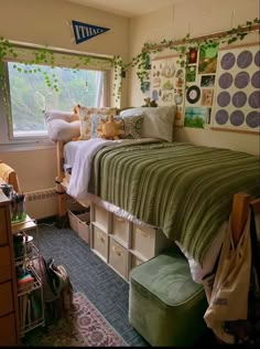 a bed room with a neatly made bed and lots of storage boxes on the floor