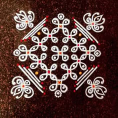 an intricately designed design on the ground in white and red colors, with small dots