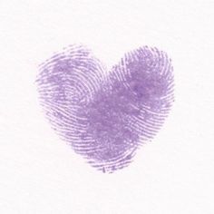 a fingerprint in the shape of a heart on a white paper with purple ink