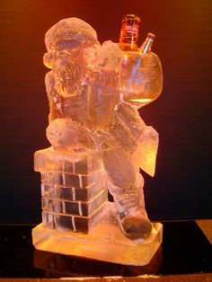 an ice sculpture with a man holding a beer bottle