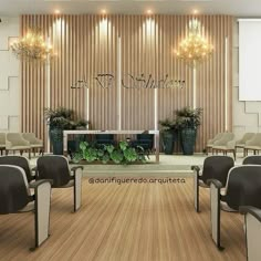 an empty conference room with chairs and plants in the center, on top of a hard wood floor