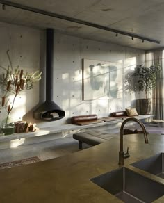 a kitchen with a sink, stove and window in the backround next to it