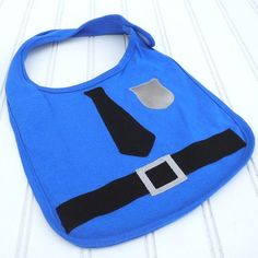 a blue bib with a neck tie on it