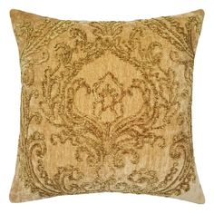 a gold pillow with an intricate design on it