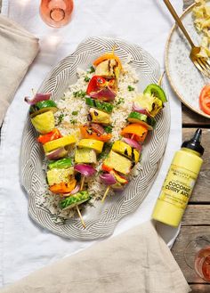 a white plate topped with vegetables and rice