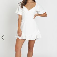 White Mini Dress, New With Tags, Never Worn. Size 10 Australian, Medium In Us Sizes. No Stains Or Flaws. Would Be Perfect For Graduation, Bridal Showers, Ect. - Made With 65% Cotton 35% Polyester & Love - Fully Lined 65% Cotton 35% Polyester - Care For Me; Line Dry In Shade Do Not Tumble Dry, Cold Iron - Length; 79cm/ 31.1in - Metal Invisible Zipper On The Center Back White Lined Mini Dress, White Flutter Sleeve Mini Dress For Party, White V-neck Mini Dress For Spring, White V-neck Sundress, Fitted Flutter Sleeve Flirty Dress, Flirty Fitted Dress With Flutter Sleeves, Fitted Flirty Mini Dress With Flutter Sleeves, White Mini Dress For Brunch, White Flirty Mini Dress