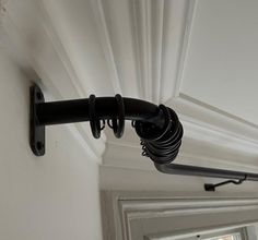 a close up of a curtain rod on a door