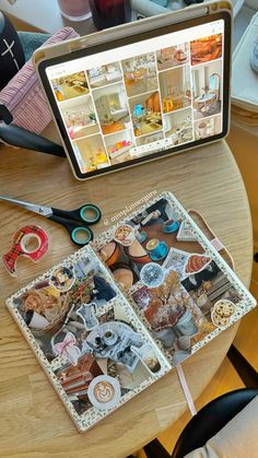 a laptop computer sitting on top of a wooden table covered in magnets and pictures