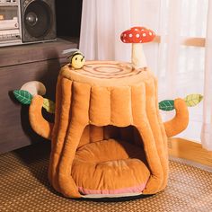 a mushroom shaped dog bed with a mushroom on top and a mushroom in the middle