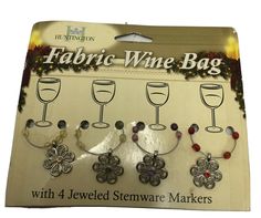 four wine glass charms with beaded stemware markers in the shape of clovers