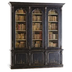 an old black bookcase with many books on the top and bottom shelves full of books