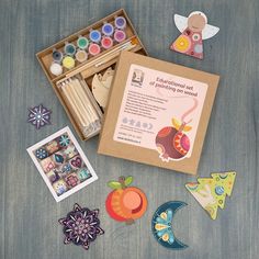 an assortment of crafting supplies in a box