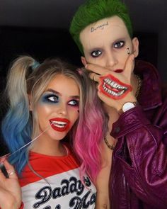 two people with makeup and hair are posing for the camera