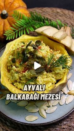 an image of food on a plate with pumpkins in the background