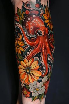 an octopus and flowers tattoo on the leg