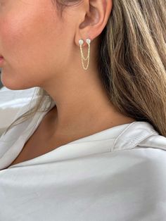 Elevate Your Style with Our Double Solitaire Stud Earring! ✨ Introducing the stunning double solitaire stud earring featuring two elegant round stones connected by delicate chains. Crafted from pure 925 silver, this unique piece is also available in luxurious yellow gold or rose gold plating. Perfectly designed for a single ear with two piercings, this earring adds a chic and modern twist to your look. Whether you're dressing up for a special occasion or looking to enhance your everyday style, this earring makes a bold statement. Don't miss out on this eye-catching accessory that combines elegance and versatility. Treat yourself or surprise someone special with this must-have piece! Shop now and shine like never before!   Be different, be unique, be elegant with MI ALMA FASHION JEWELRY. ♥ Double Stud Earrings, Chain Threader Earrings, Classic Pearl Earrings, Earrings Chain, Chain Earring, Round Solitaire, Solitaire Studs, Earring Gold, Cz Earrings