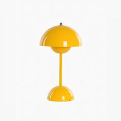 a yellow table lamp is shown against a white background with the light turned on and off