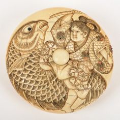 a wooden plate with an image of a woman holding a bird on it's back