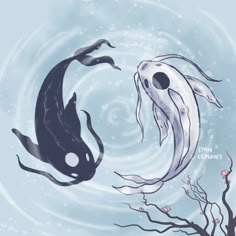 two black and white koi fish swimming next to each other in water with bubbles