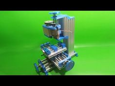 a green screen with a model of a machine on it