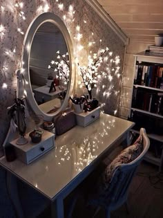 a desk with a mirror and some lights on it