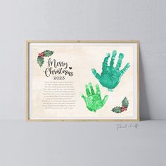 a christmas card with handprints on it