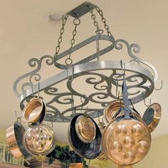 a chandelier with pots and pans hanging from it