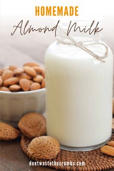 homemade almond milk in a glass jar next to nuts