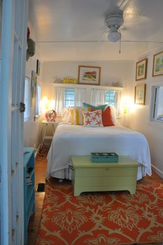 a bedroom with a bed, dresser and other items in the room that is well decorated