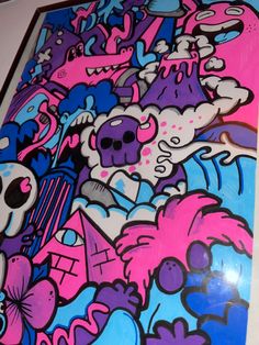 a skateboard covered in lots of graffiti on the side of a wall with pink, blue and purple colors