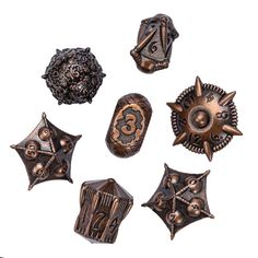 six antique style metal buttons with numbers and symbols on them, all in different shapes